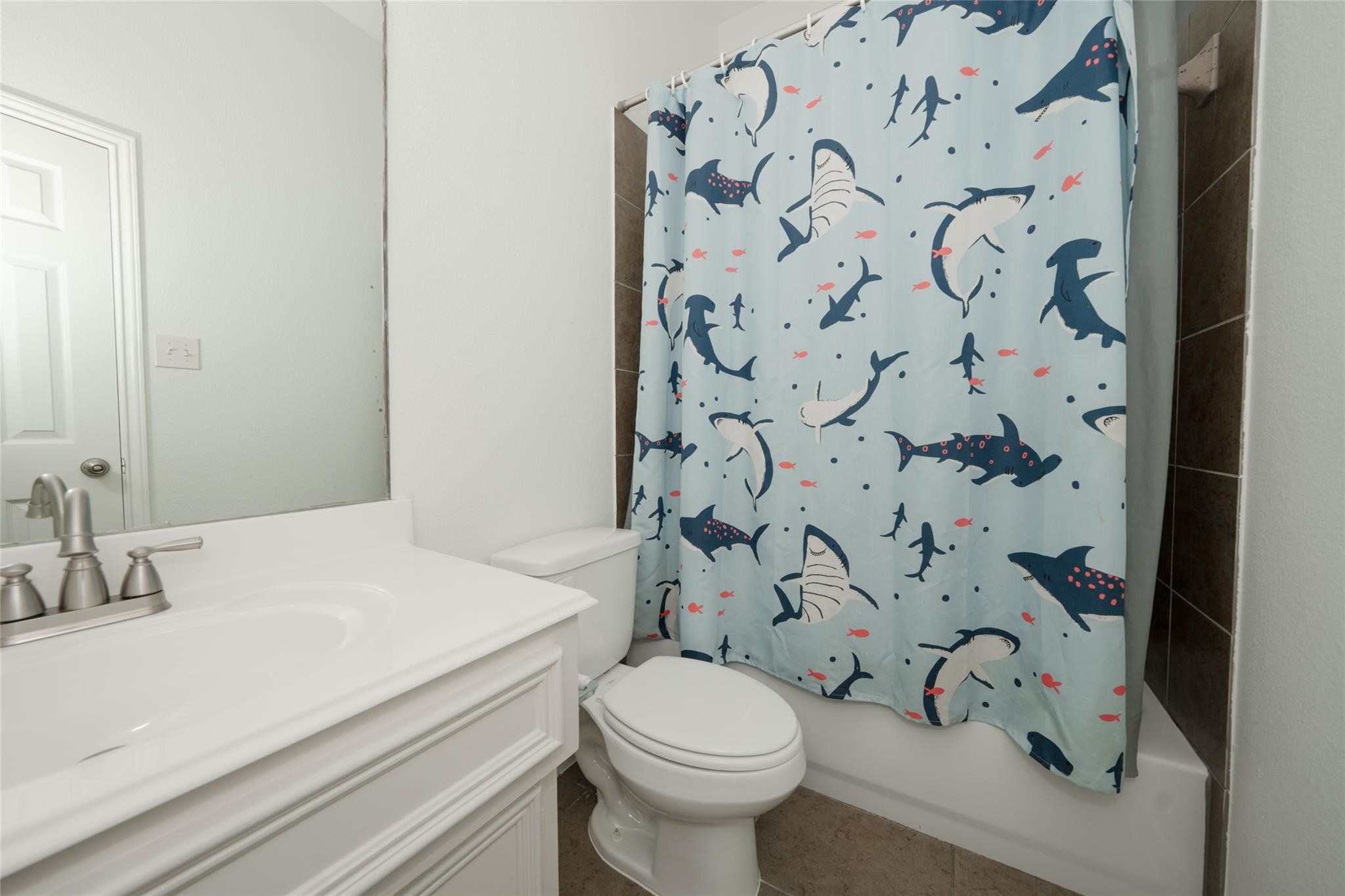 14830 Barton Grove Lane Humble, TX 77396 - Photo 27 of 36 a bathroom with a sink and toilet