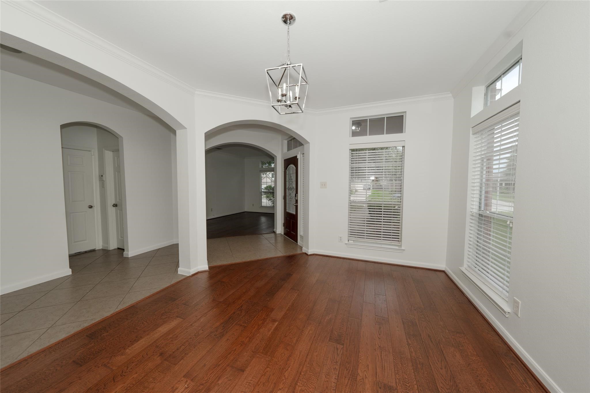 14830 Barton Grove Lane Humble, TX 77396 - Photo 6 of 36 a view of empty room with wooden floor and fan