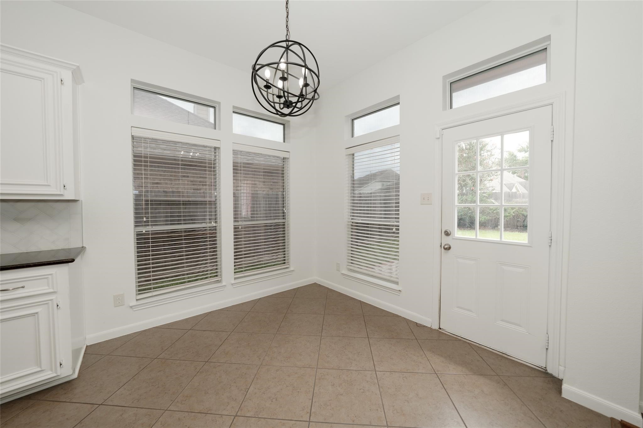 14830 Barton Grove Lane Humble, TX 77396 - Photo 10 of 36 a view of an empty room with a window