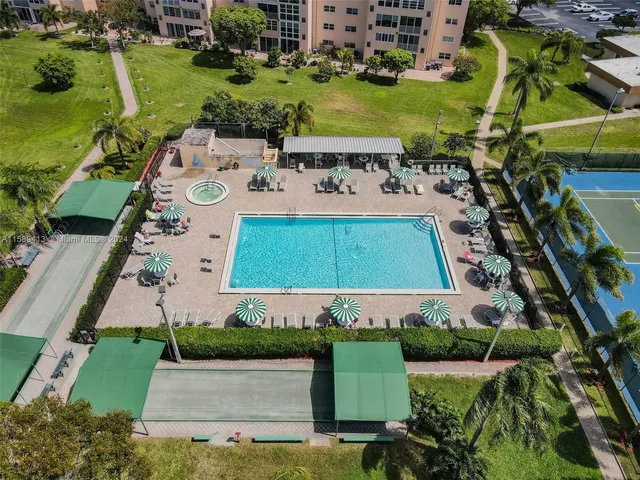 an aerial view of a house with a garden