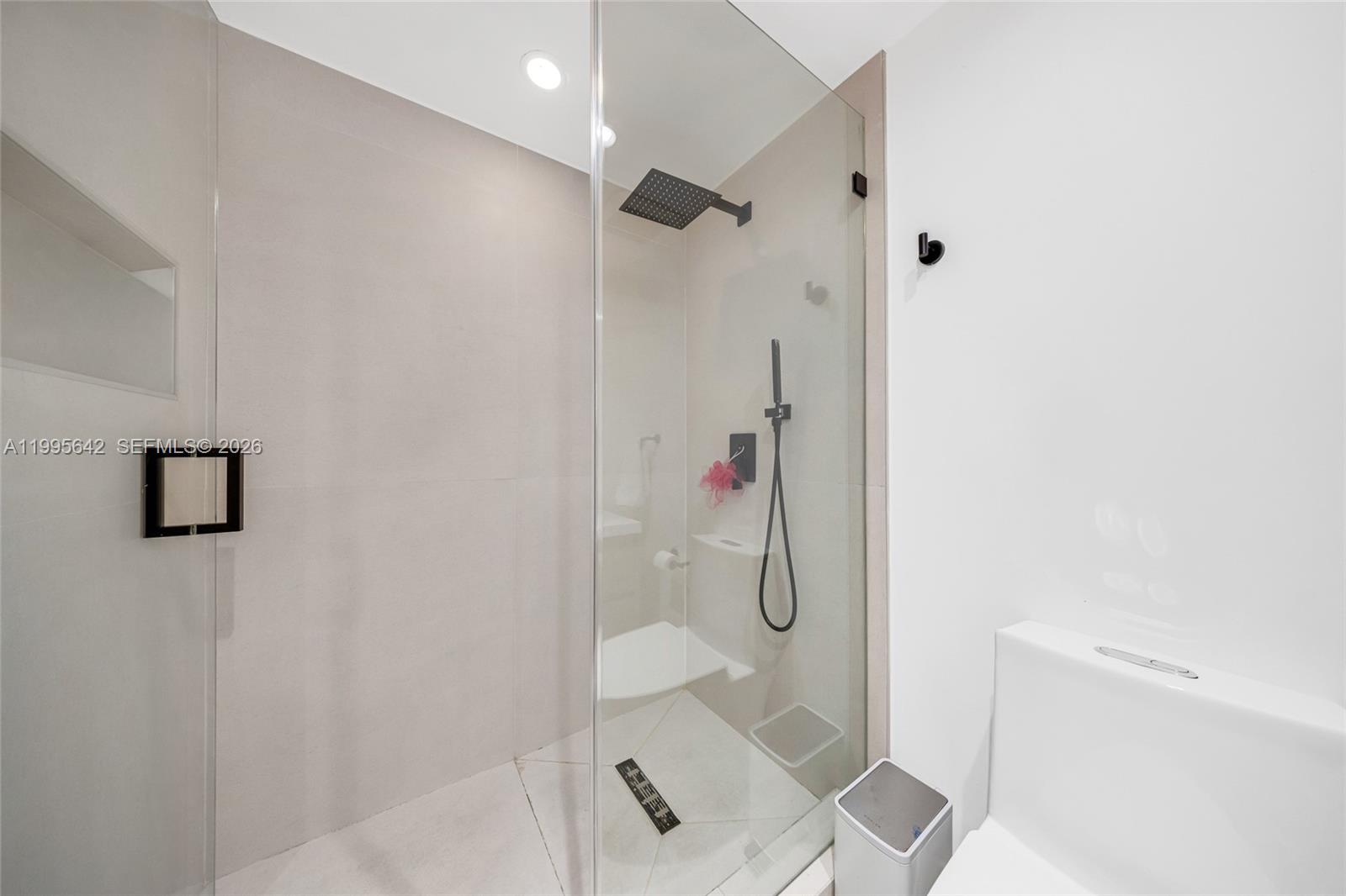 701 Brickell Key Boulevard, Unit 1112 Miami, FL 33131 - Photo 17 of 31 a bathroom with a shower toilet and sink