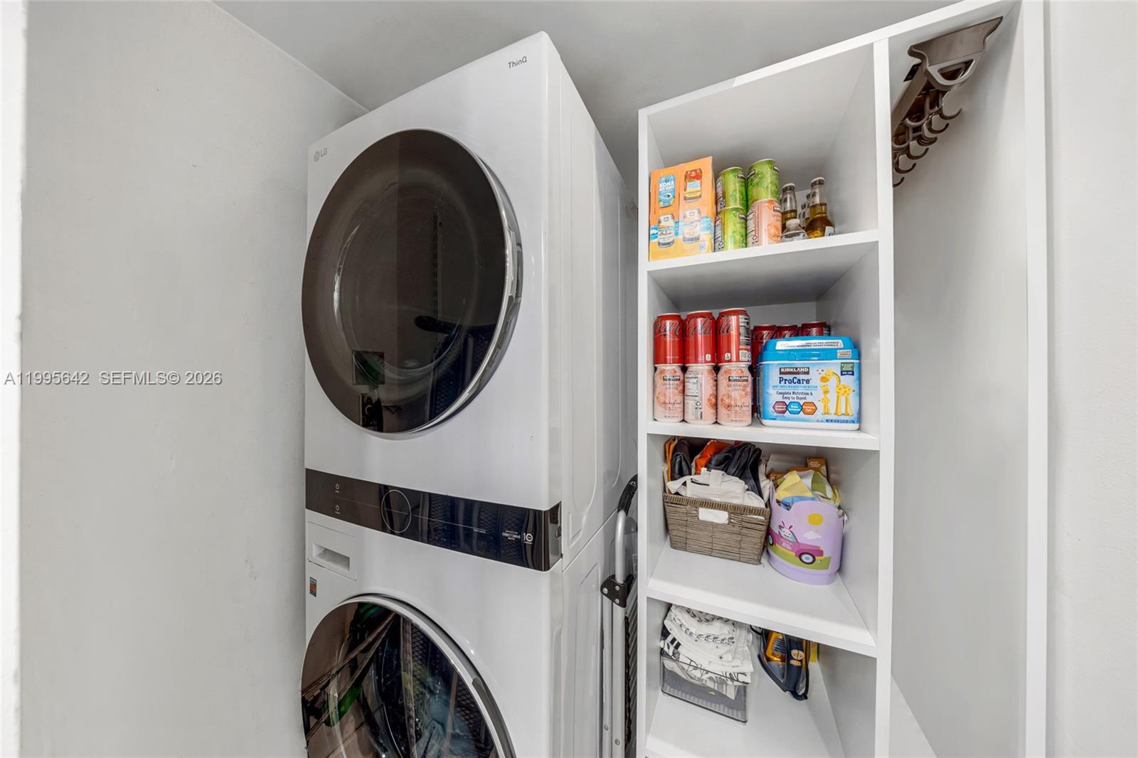 701 Brickell Key Boulevard, Unit 1112 Miami, FL 33131 - Photo 20 of 31 a utility room with dryer and washer
