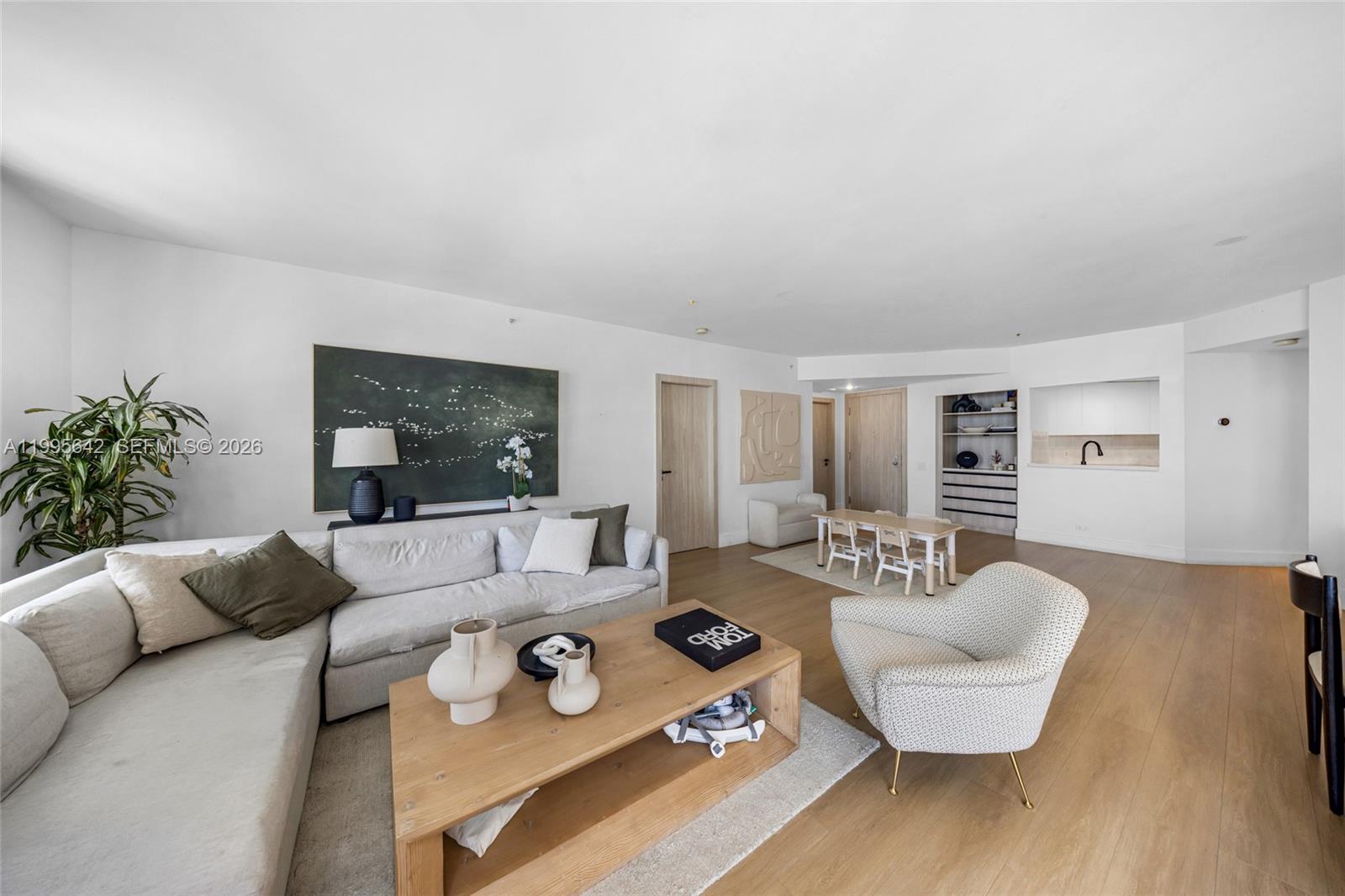701 Brickell Key Boulevard, Unit 1112 Miami, FL 33131 - Photo 22 of 31 a living room with furniture and a large window