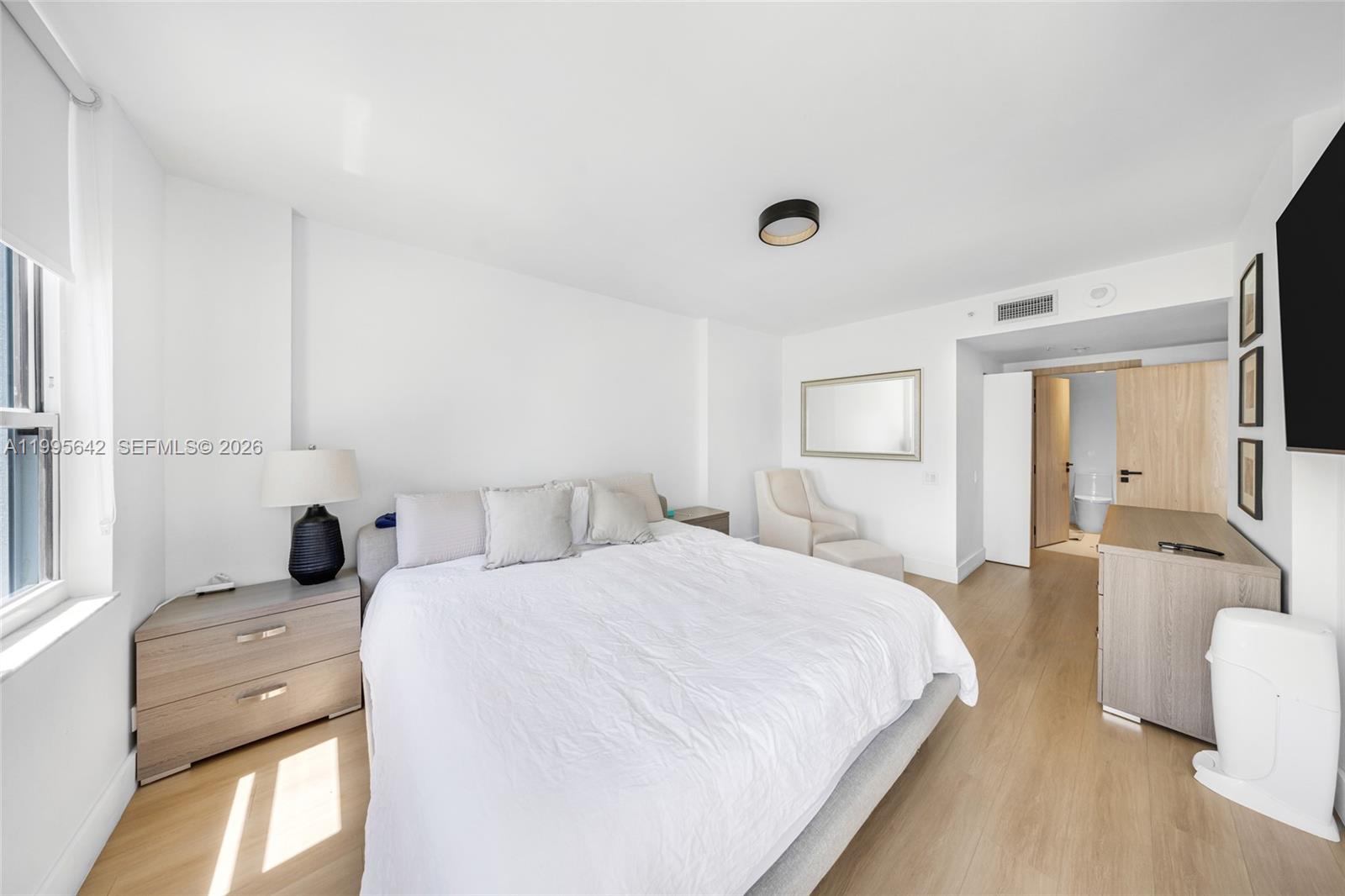 701 Brickell Key Boulevard, Unit 1112 Miami, FL 33131 - Photo 8 of 31 a bedroom with a bed and a couch