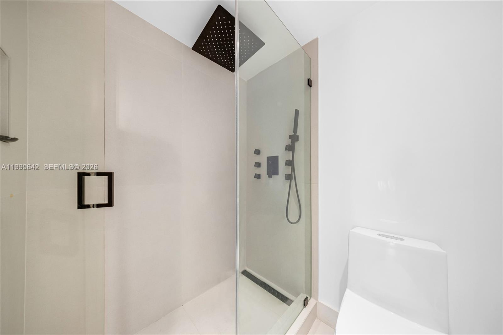 701 Brickell Key Boulevard, Unit 1112 Miami, FL 33131 - Photo 10 of 31 a bathroom with a shower and a sink