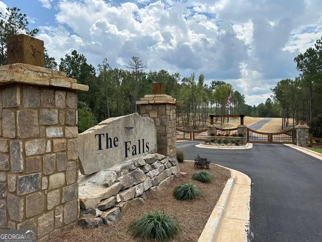 a view of a patio with couches table and chairs and potted plants