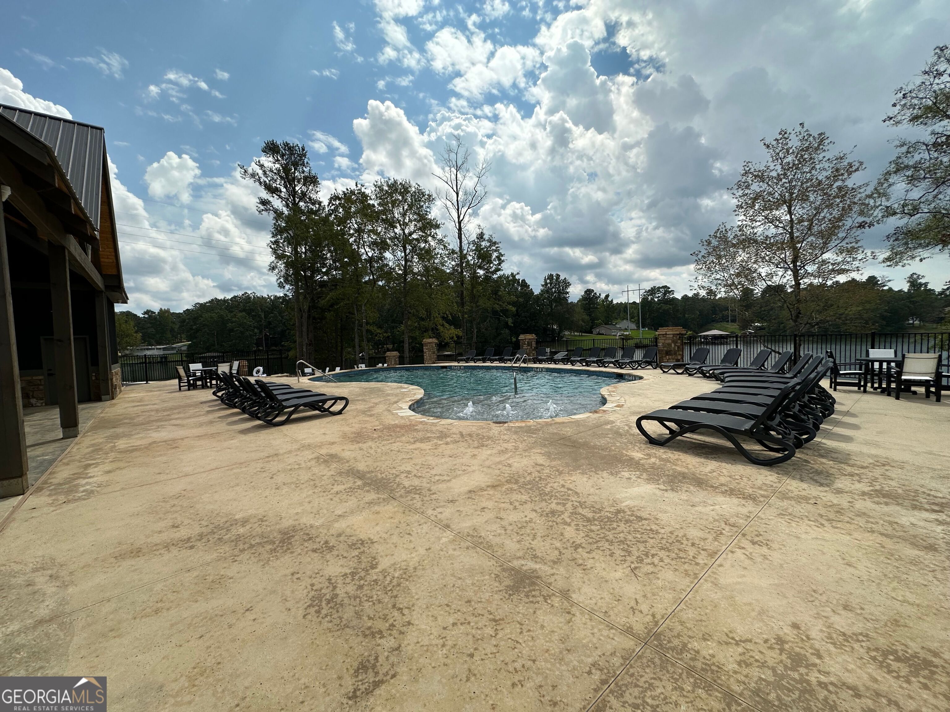 302 Wind Rock Ridge Northeast Milledgeville, GA 31061 - Photo 8 of 11 a view of outdoor space with swimming pool and furniture