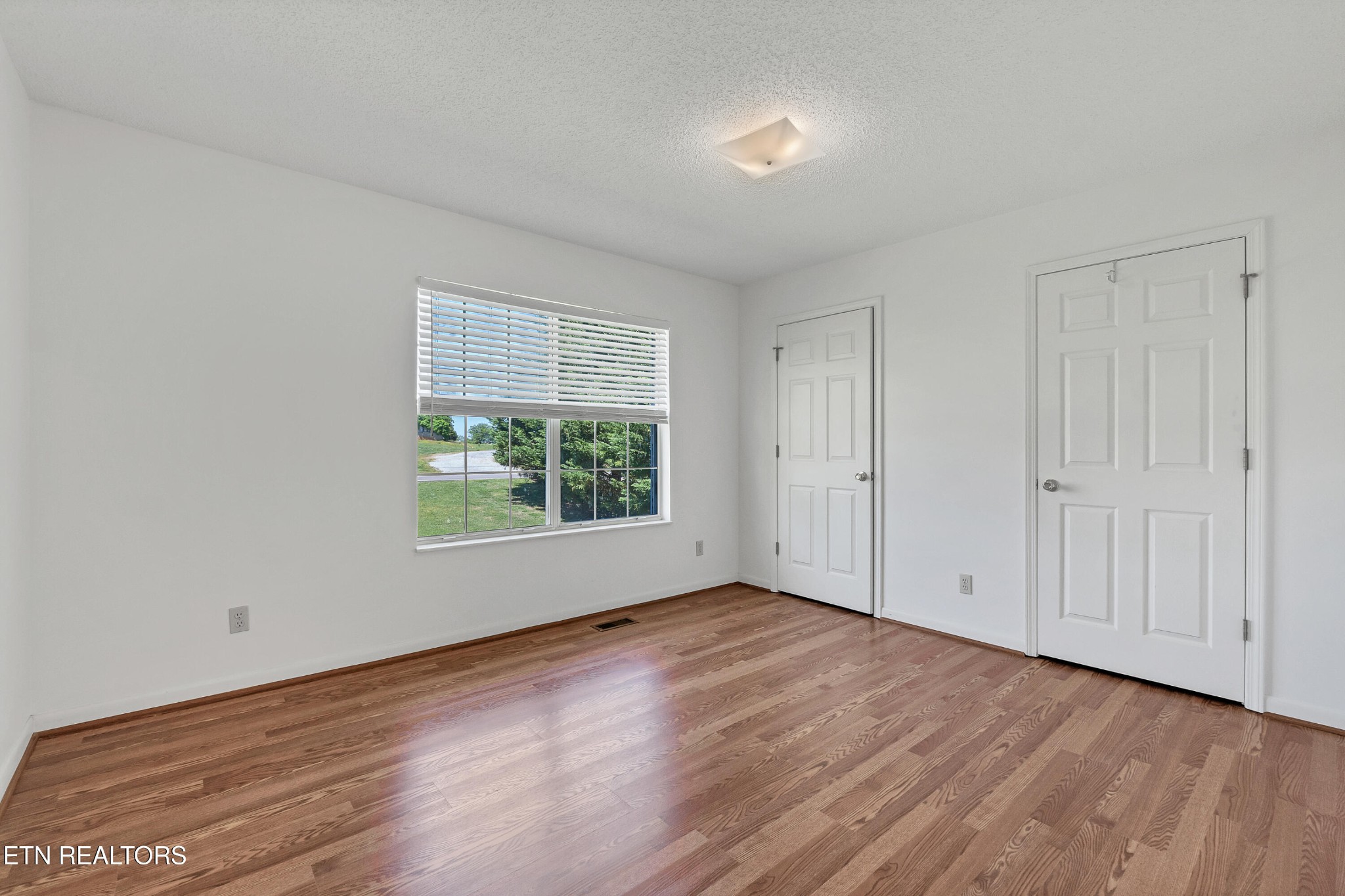 2036 Little Best Road Maryville, TN 37803 - Photo 36 of 54 a view of an empty room with wooden floor and a window