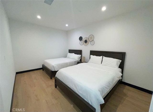 a bedroom with bed and a night stand