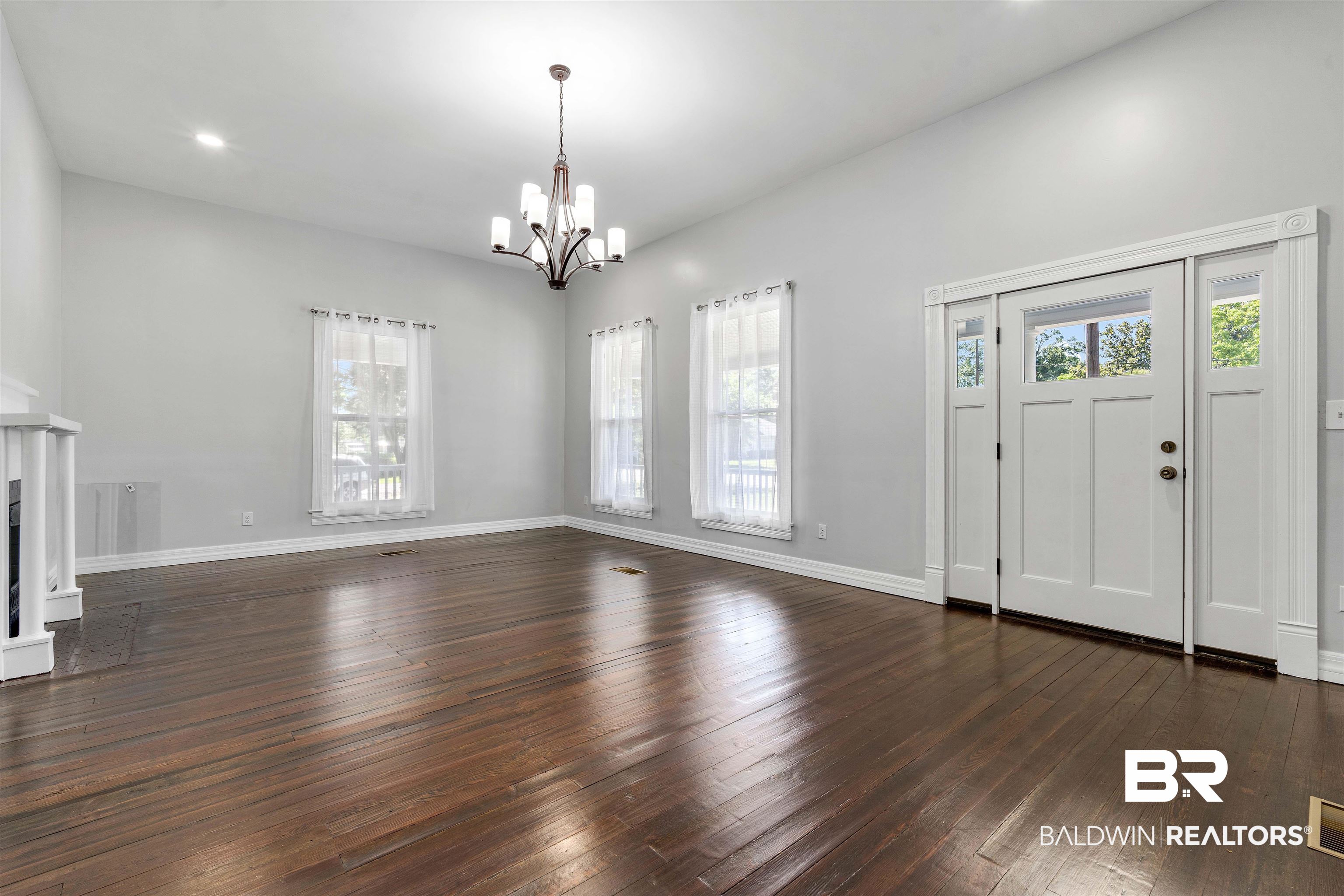 407 East 2nd Street Bay Minette, AL 36507 - Photo 14 of 40 Foyer with dark wood finished floors, plenty of natural light, recessed lighting, and a fireplace