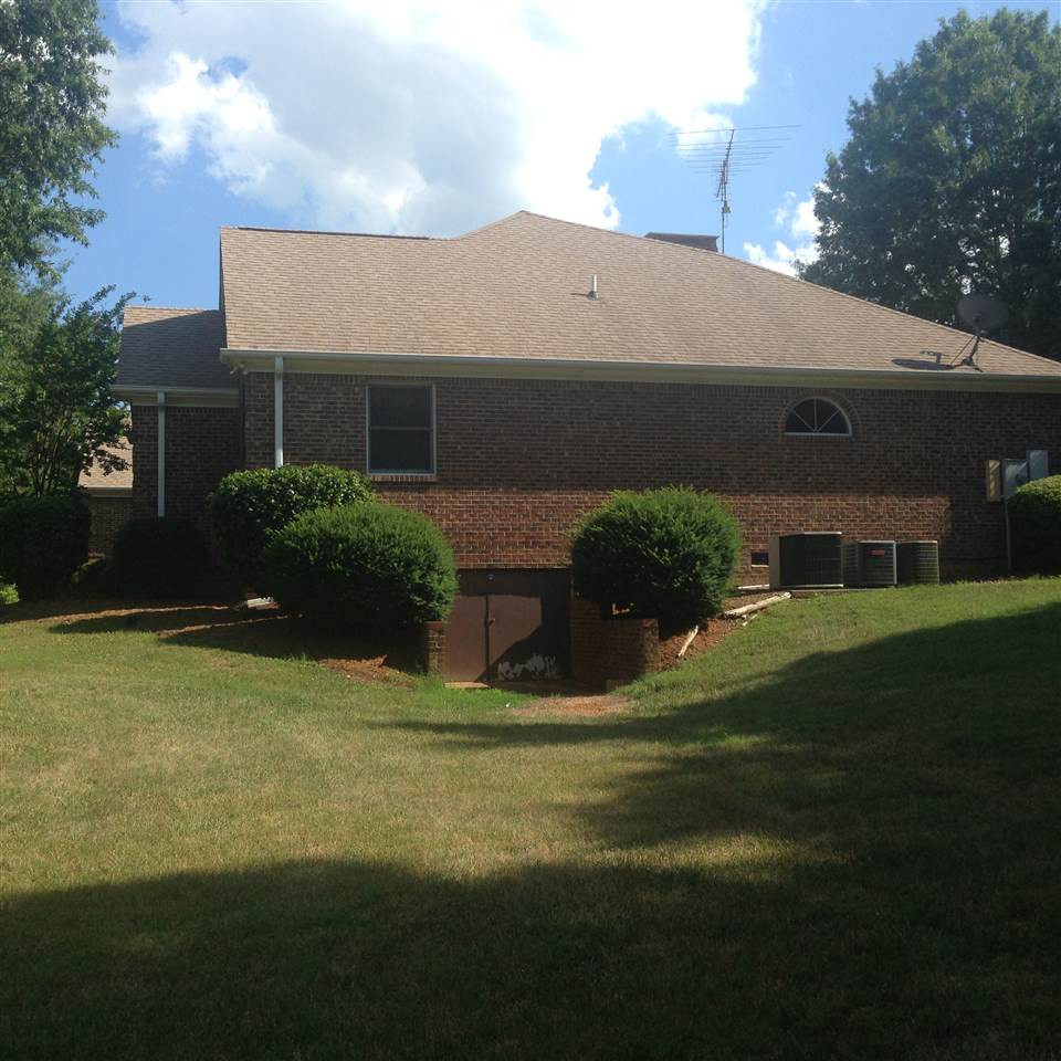 9919 Quail Roost Road Bahama, NC 27503 - Photo 25 of 25 West end of home with walk in crawlspace door