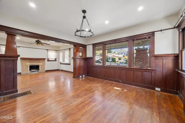 a view of livingroom with hardwood floor and a ceiling fan