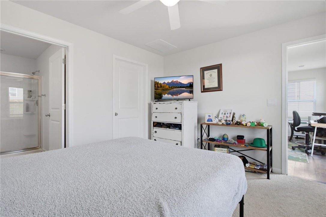 216 Boxbury Way Fountain Inn, SC 29644 - Photo 20 of 28 An inviting bedroom features soft carpet flooring and direct access to an attached bathroom.