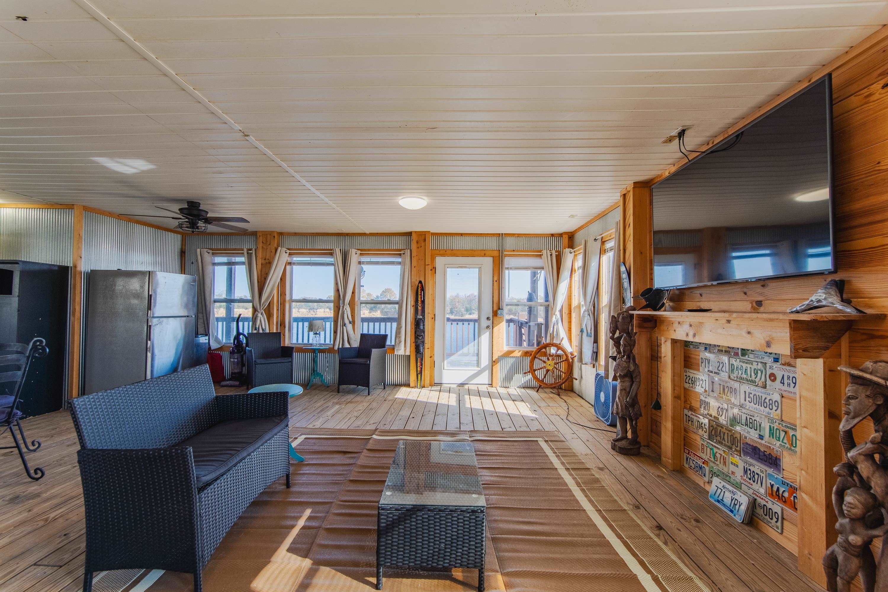 1111 Leaning Trees Lane Adamsville, TN 38310 - Photo 16 of 25 a living room with fireplace furniture and a flat screen tv