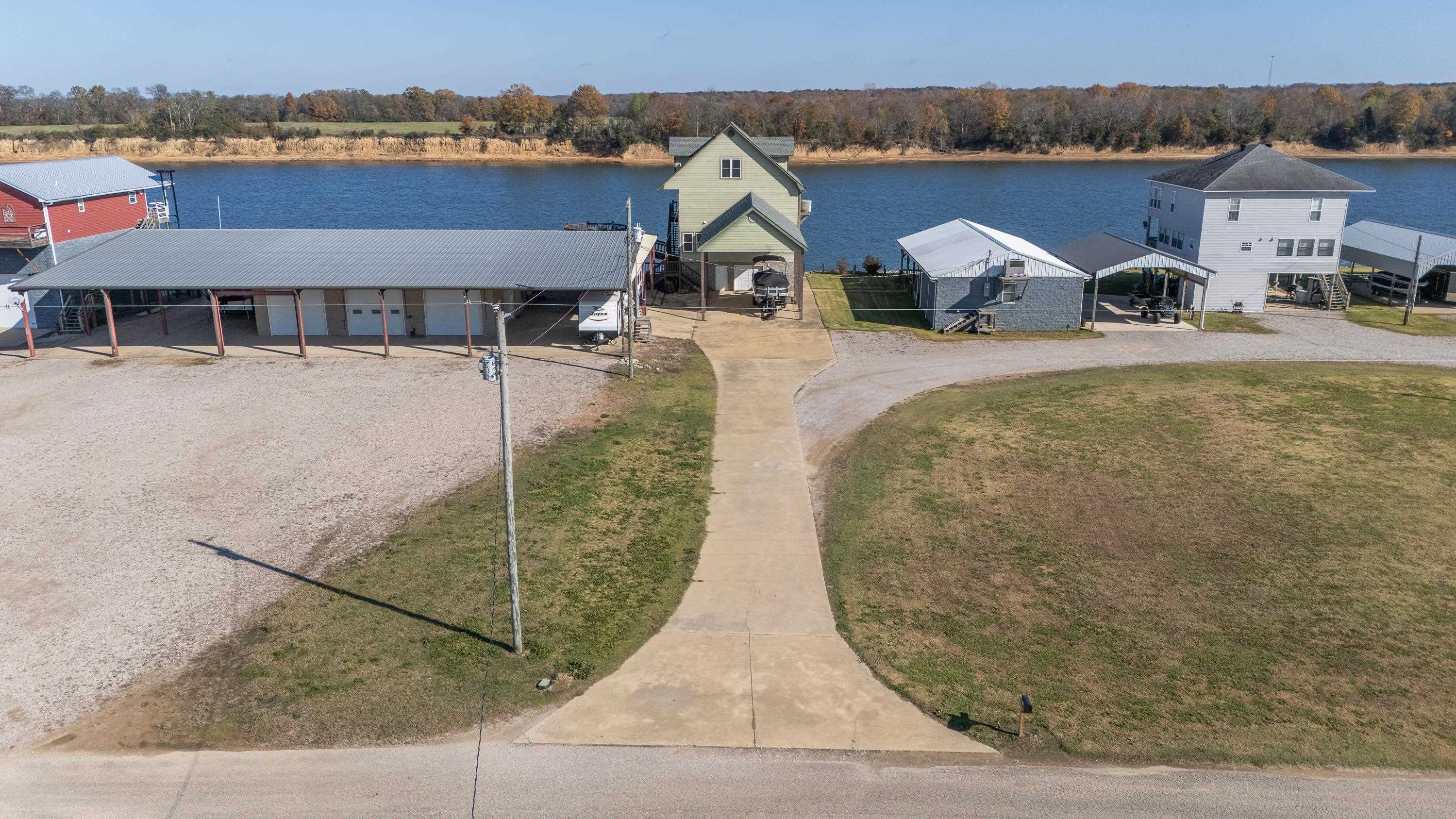 1111 Leaning Trees Lane Adamsville, TN 38310 - Photo 22 of 25 an aerial view of a house with garden space and seating