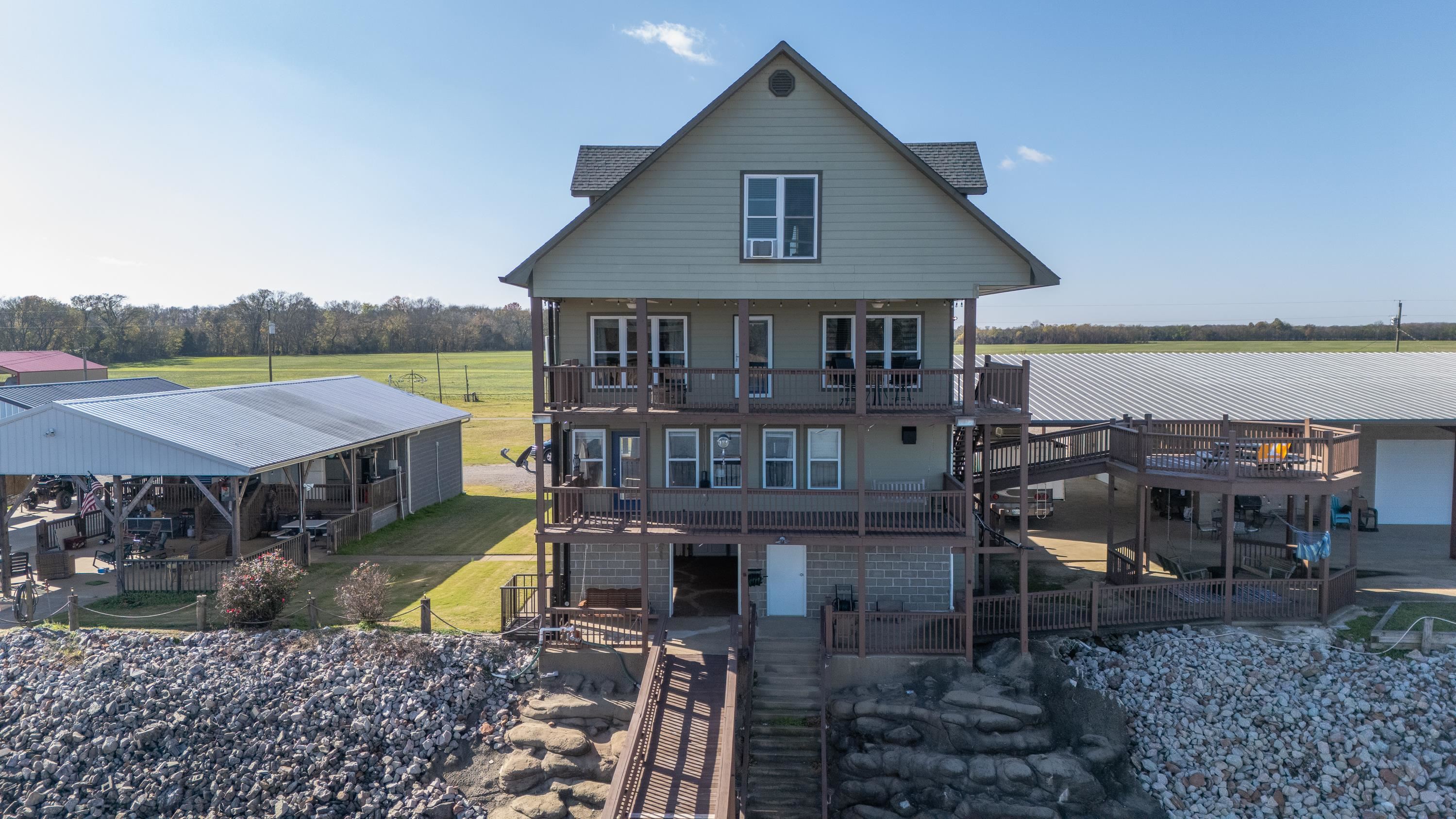 1111 Leaning Trees Lane Adamsville, TN 38310 - Photo 3 of 25 a view of a house with roof deck
