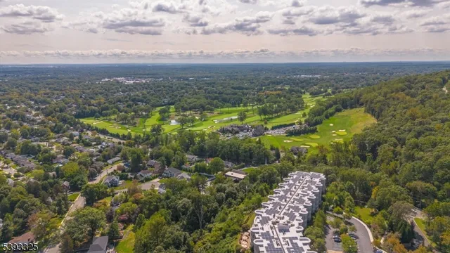 a view of a street with cars on both side