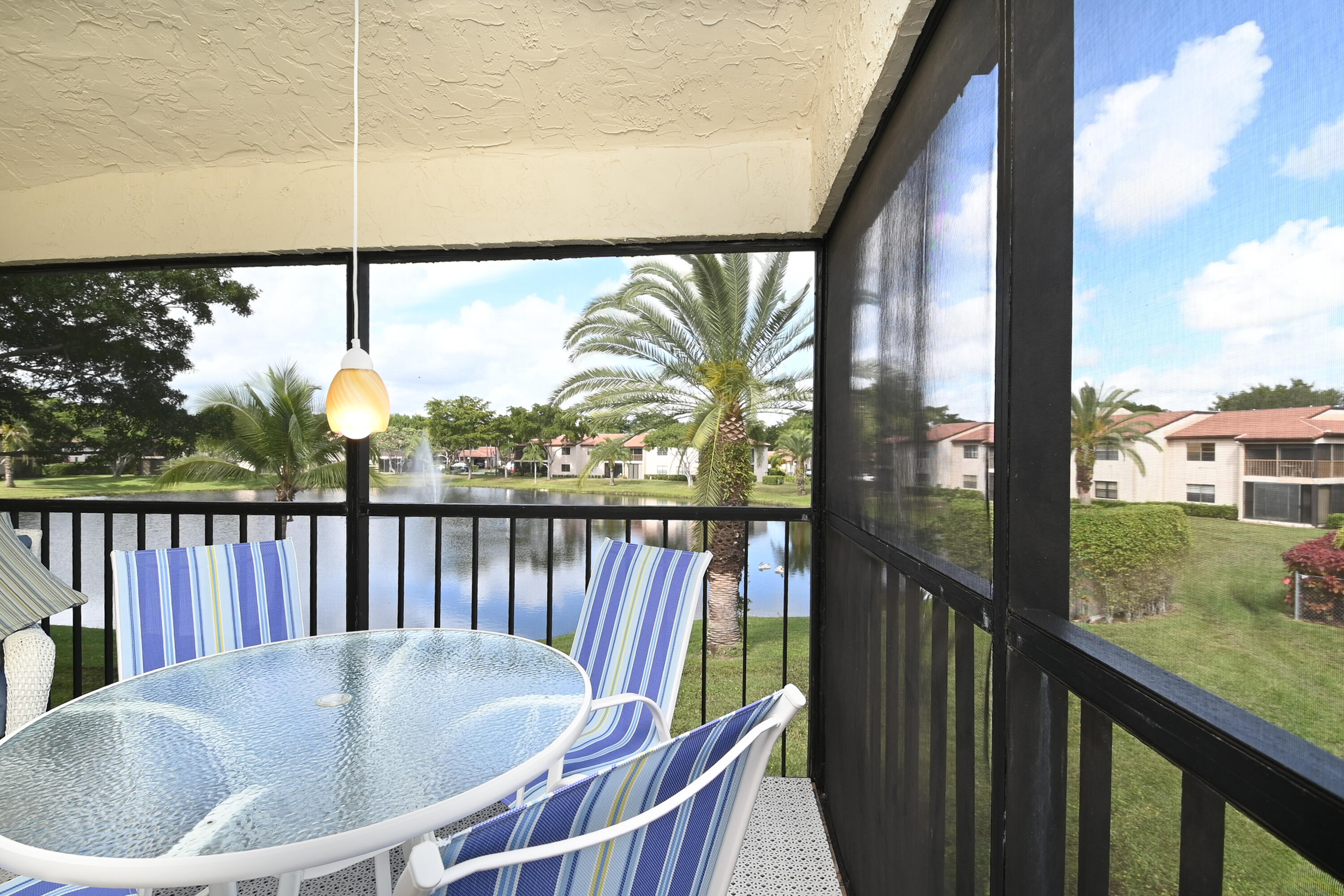 9259 Vista Del Lago, Unit 18J Boca Raton, FL 33428 - Photo 16 of 37 a view of balcony with furniture