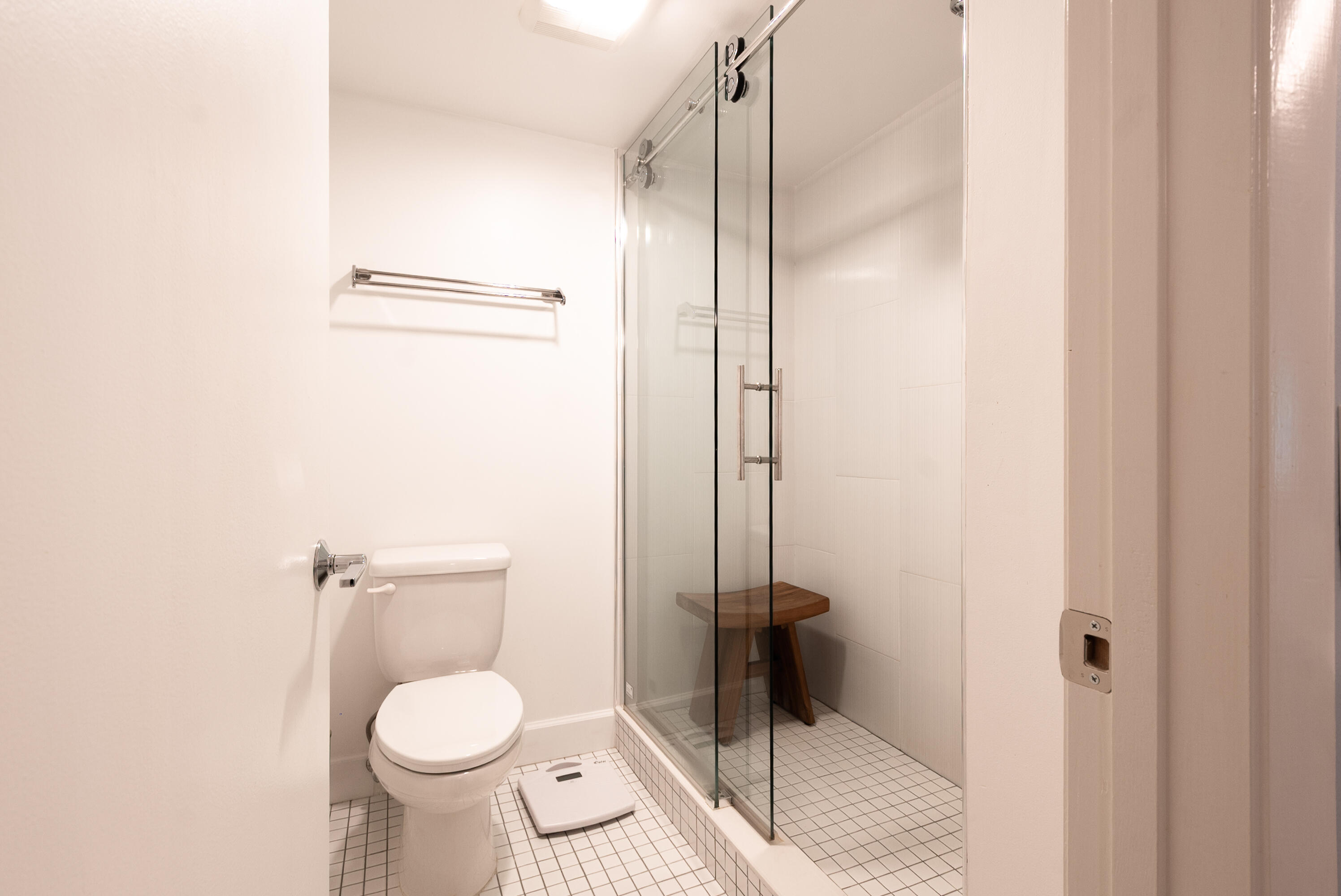 9259 Vista Del Lago, Unit 18J Boca Raton, FL 33428 - Photo 20 of 37 a bathroom with a toilet and a shower