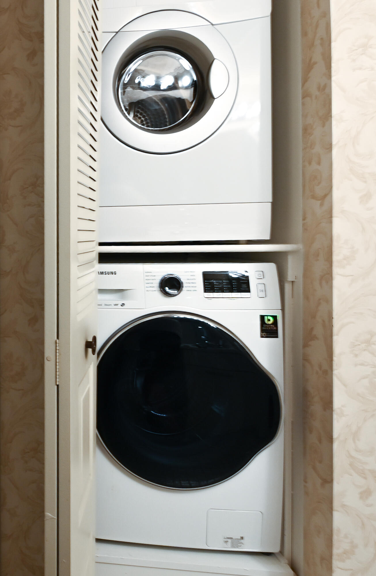 9259 Vista Del Lago, Unit 18J Boca Raton, FL 33428 - Photo 24 of 37 a close up view of washer and dryer