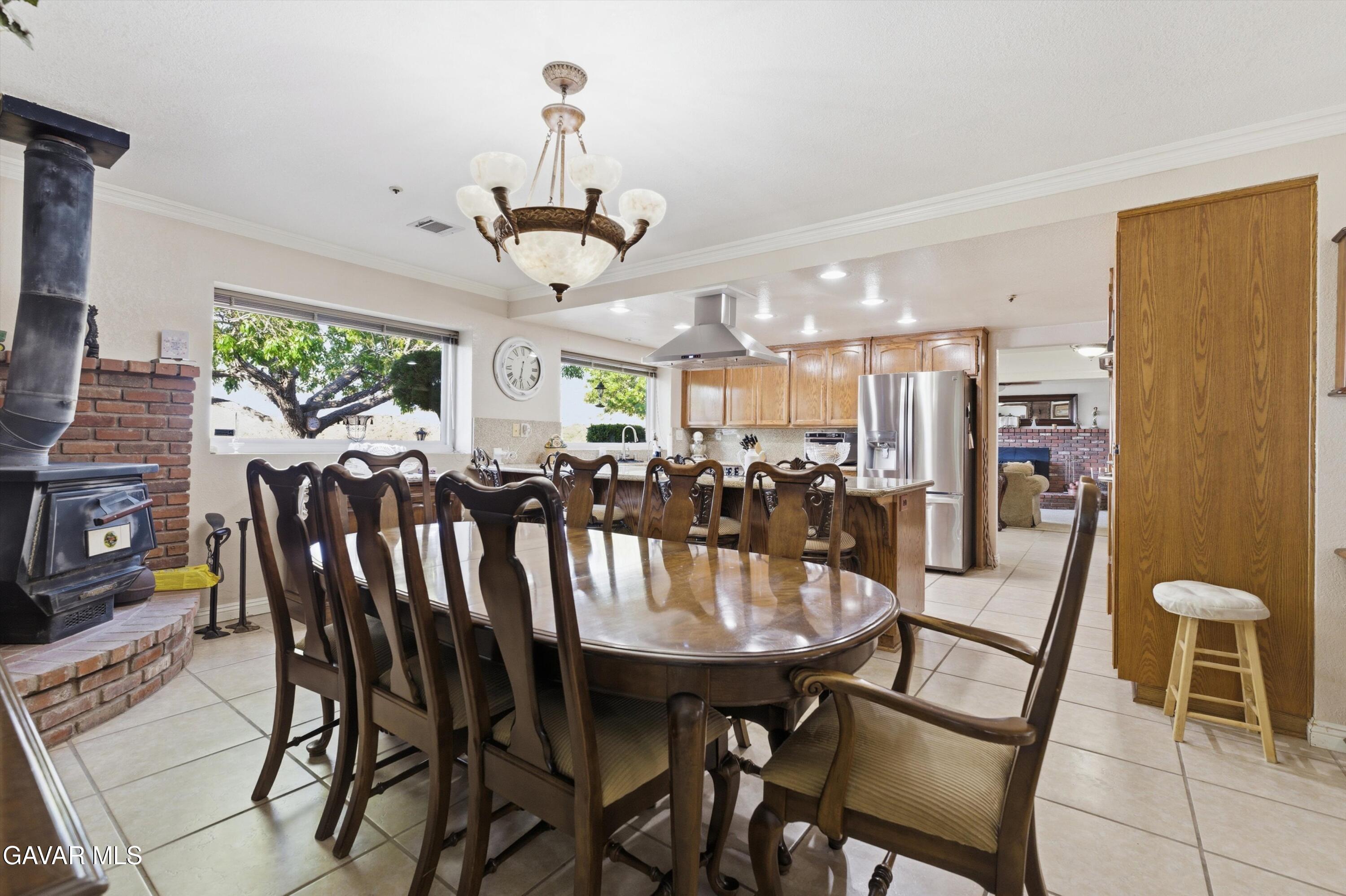5801 Hacienda Ranch Road Palmdale, CA 93551 - Photo 20 of 69 a view of a dining room with furniture window and outside view