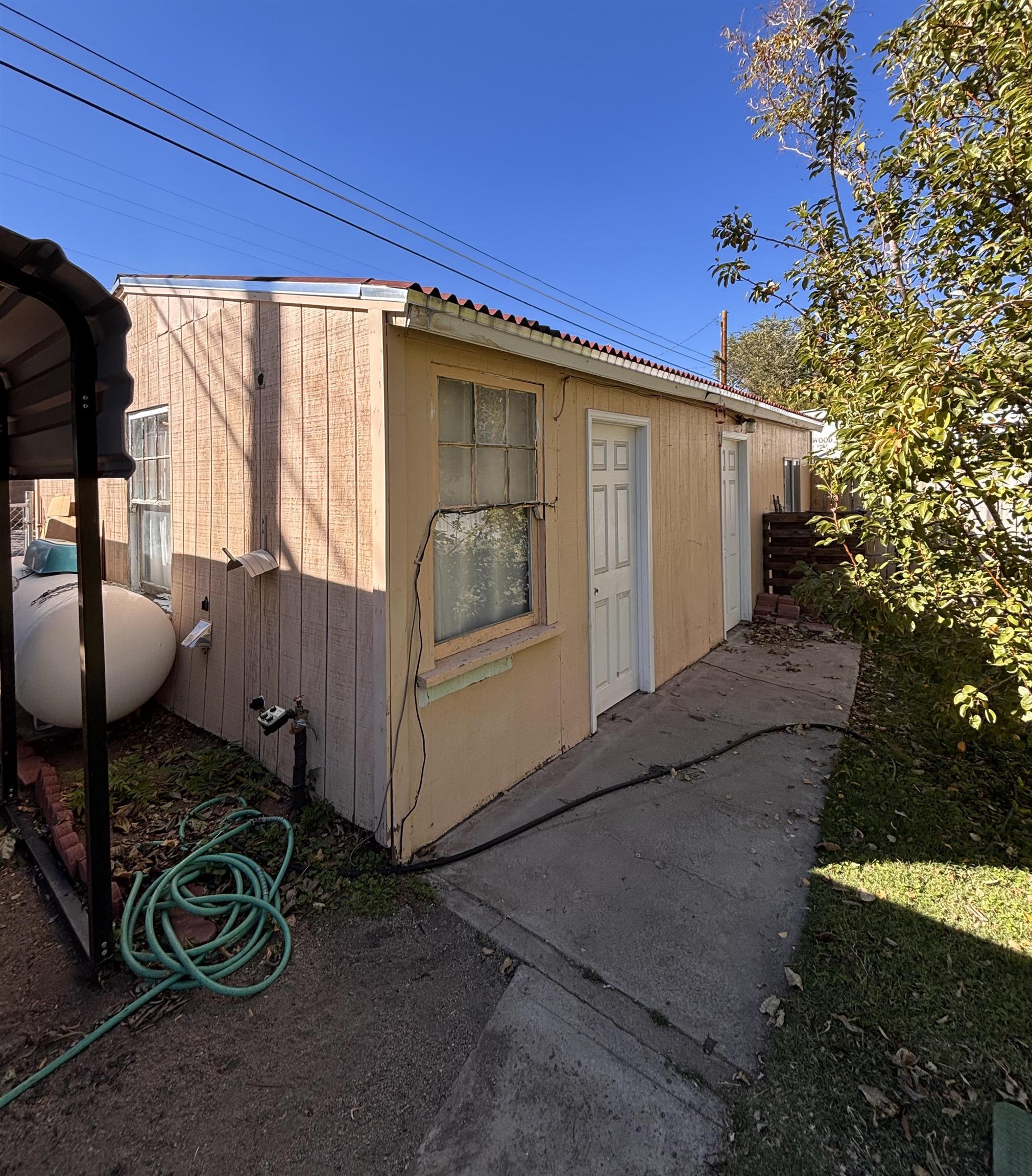 137 East Payne Street, Unit 5 Independence, CA 93526 - Photo 11 of 11 a front view of a house with sitting area