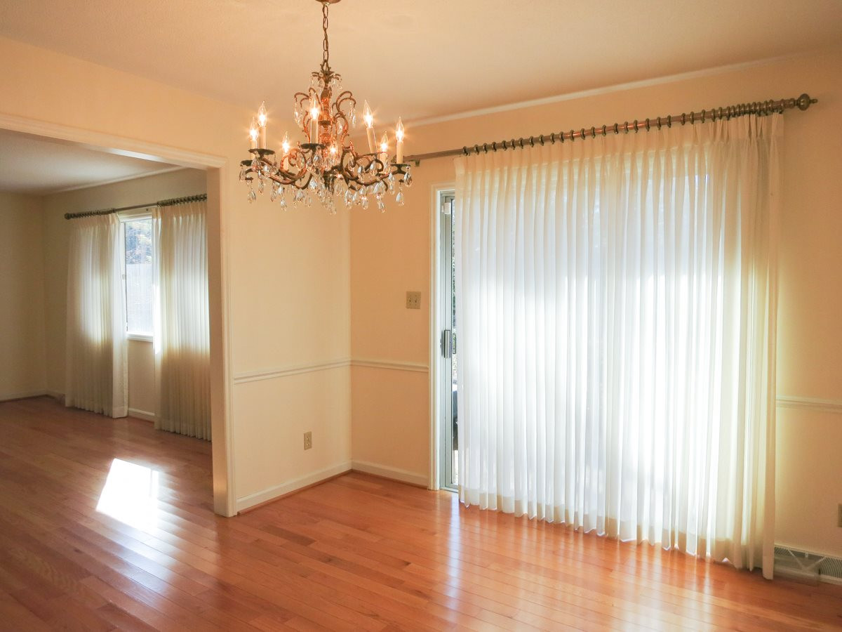 5809 Old Forge Circle Raleigh, NC 27609 - Photo 5 of 25 The formal Dining Rm offers a hardwd flr, chair rail molding & sliders to the upper Patio - great for grilling and entertaining. Dining Room