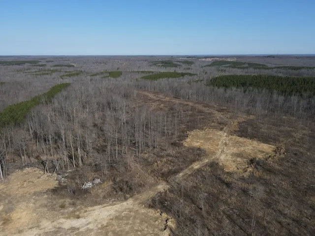 a view of a lake next to a yard