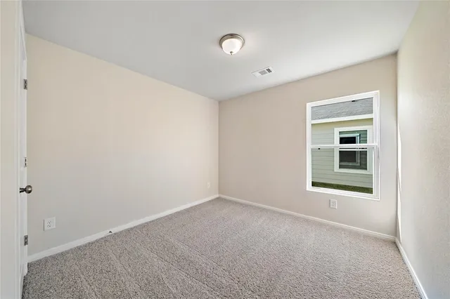 a bathroom with a granite countertop sink toilet mirror and bathtub