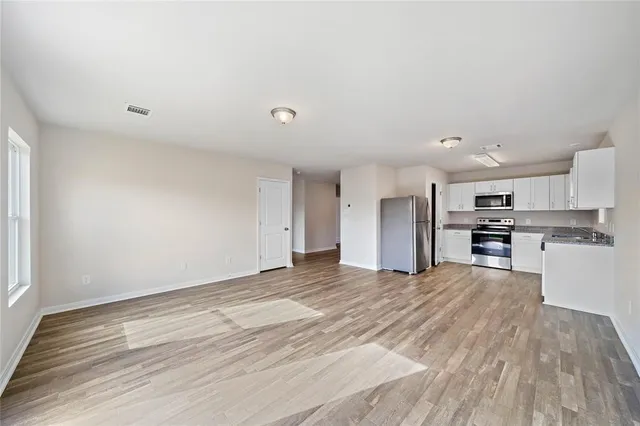 a view of kitchen with wooden floor
