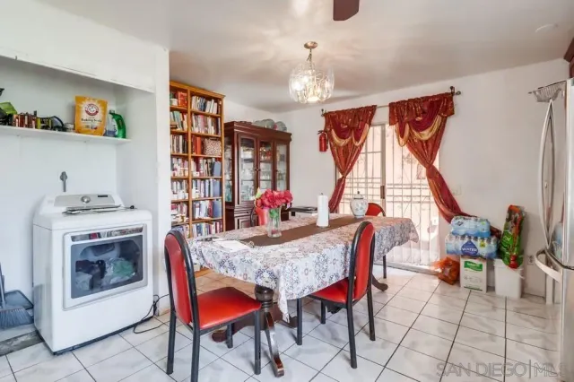 a dining room with furniture and window