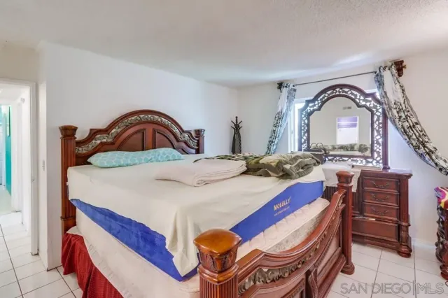 a bedroom with a bed and a sink