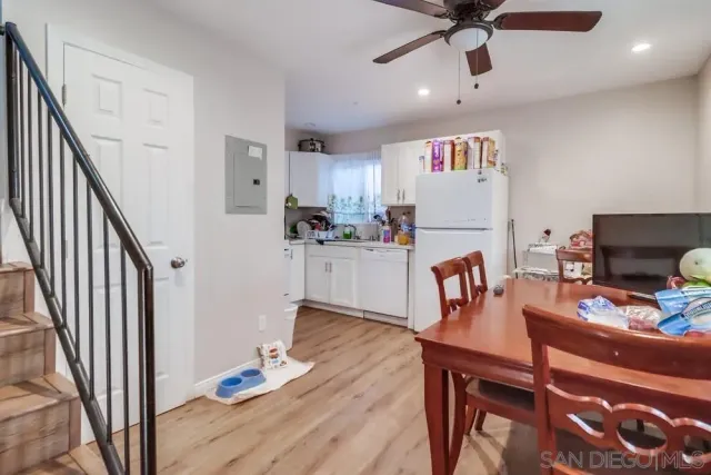 a dining room with furniture and window