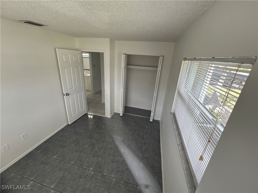18194 Iris Road Fort Myers, FL 33967 - Photo 33 of 33 wooden floor in a hall with an entryway