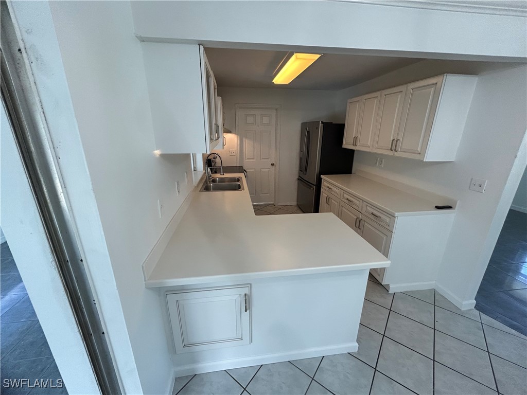 18194 Iris Road Fort Myers, FL 33967 - Photo 6 of 33 a room with washing machine
