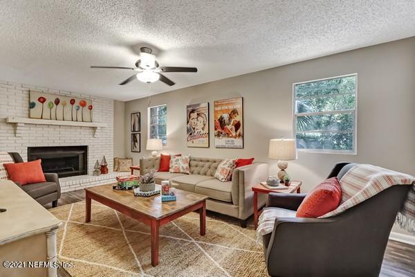 100 Lighthouse Road South Jacksonville, FL 32225 - Photo 1 of 33 a living room with furniture and a fireplace