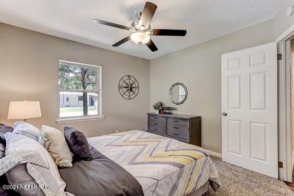 100 Lighthouse Road South Jacksonville, FL 32225 - Photo 23 of 33 a bedroom with a large bed and a window