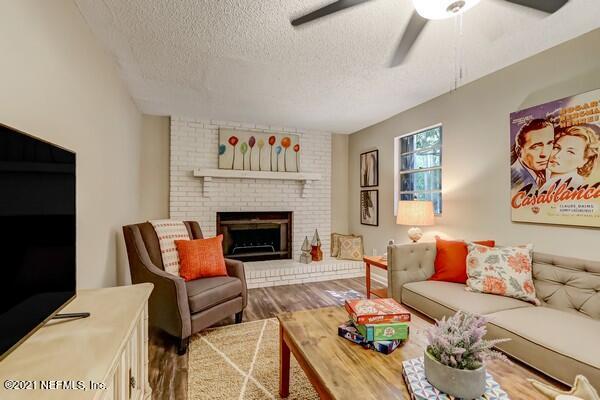 100 Lighthouse Road South Jacksonville, FL 32225 - Photo 3 of 33 a living room with furniture and a fireplace