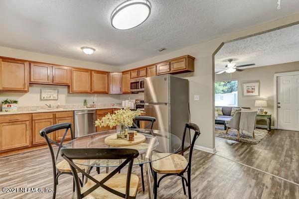 100 Lighthouse Road South Jacksonville, FL 32225 - Photo 8 of 33 a view of kitchen with refrigerator dining table and chairs