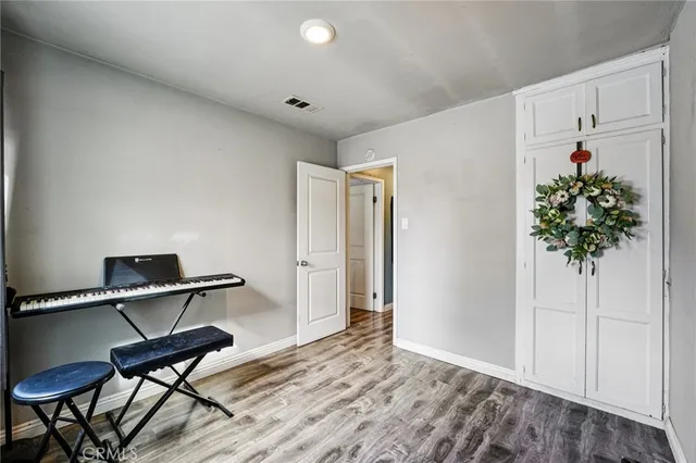 a room with furniture and a potted plant