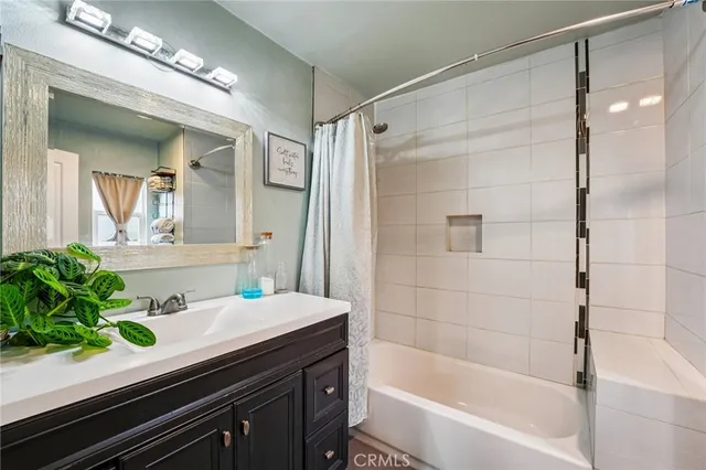 a bathroom with a toilet a sink and a mirror