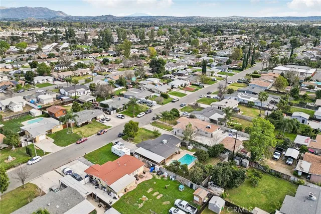 an aerial view of residential houses with outdoor space