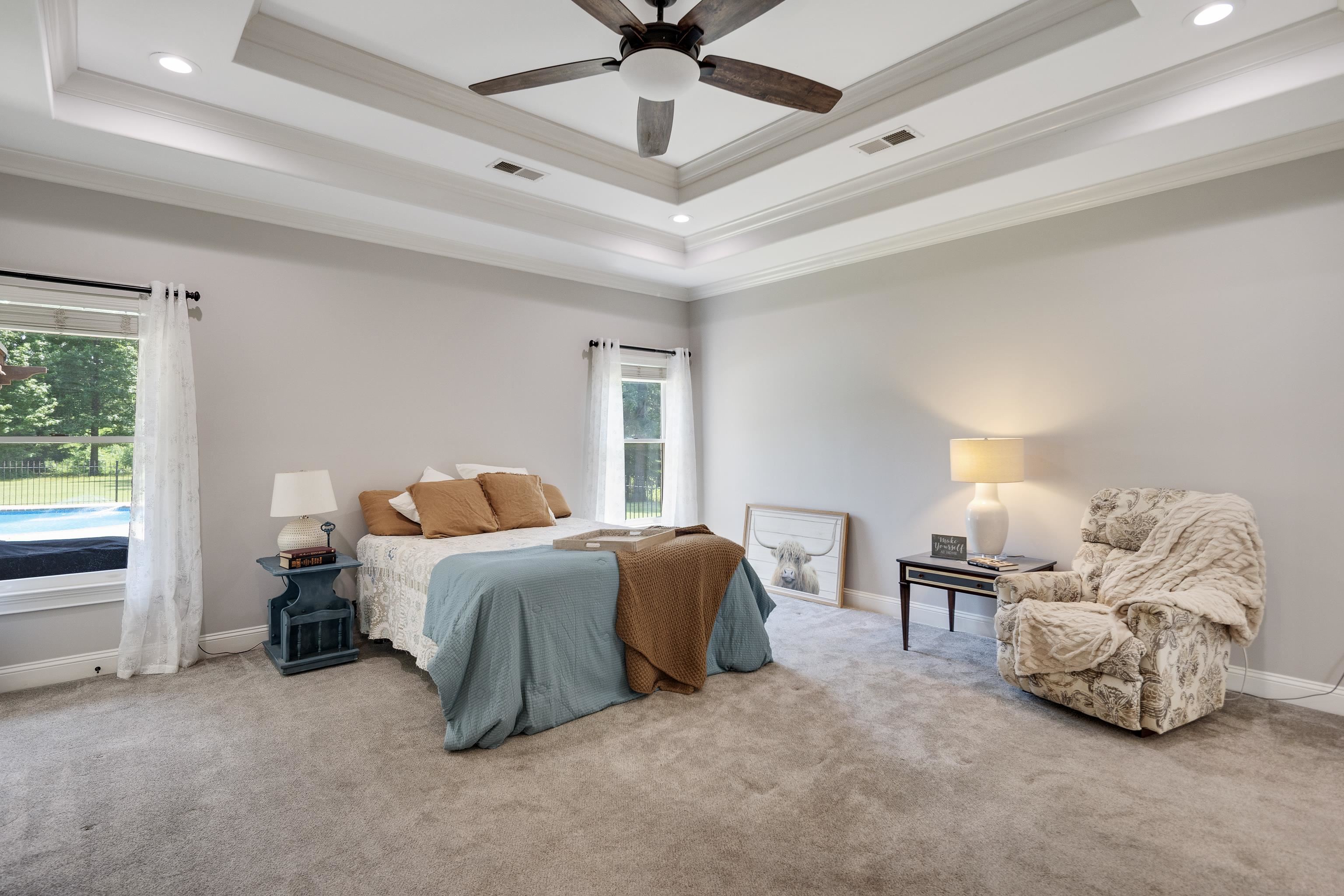 9028 Osborntown Road Arlington, TN 38002 - Photo 27 of 40 a spacious bedroom with a bed and a window