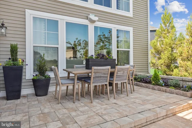 a dining area with a table and chairs