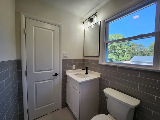 a bathroom with a toilet and a sink