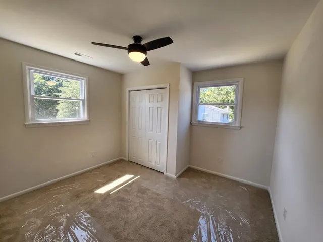 a bathroom with a white tub and a shower