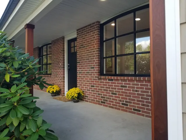 a front view of a house with a garden