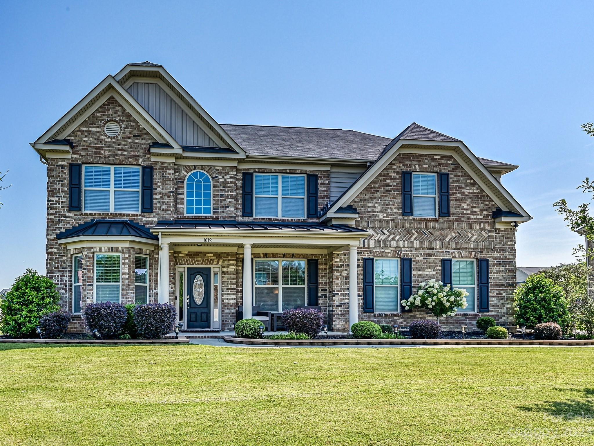 1012 Thorndale Road Indian Trail, NC 28079 - Photo 1 of 36 a front view of a house with a yard