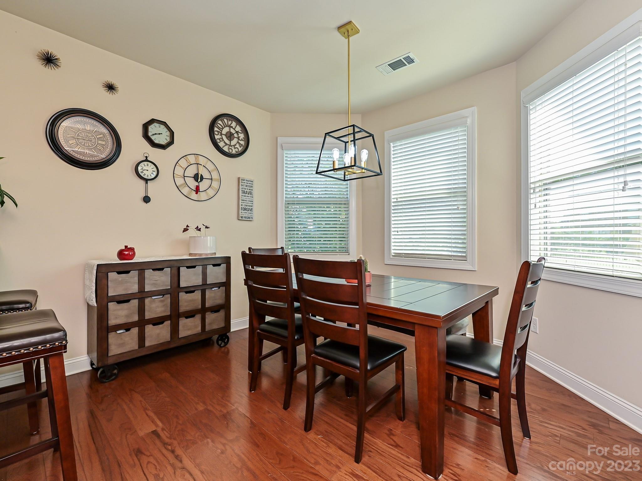 1012 Thorndale Road Indian Trail, NC 28079 - Photo 13 of 36 a view of a dining room with furniture window and wooden floor