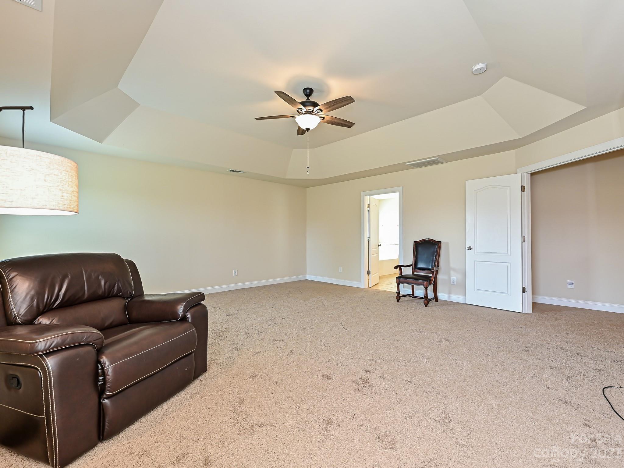 1012 Thorndale Road Indian Trail, NC 28079 - Photo 20 of 36 a living room with furniture and a ceiling fan